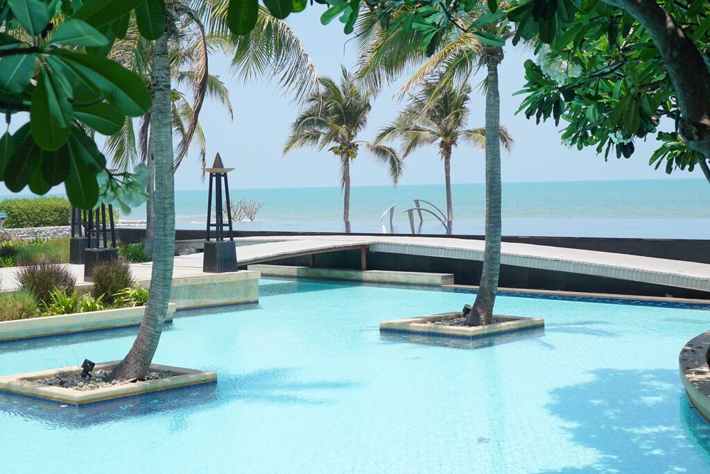 Infinity pool infront of beach front villa