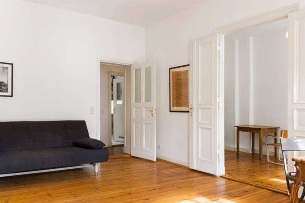 living room and a couch that can be made into a double bed