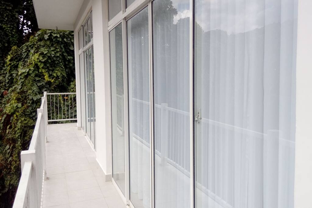 Balconies with views of trees, flowers, hills and wildlife on all sides.