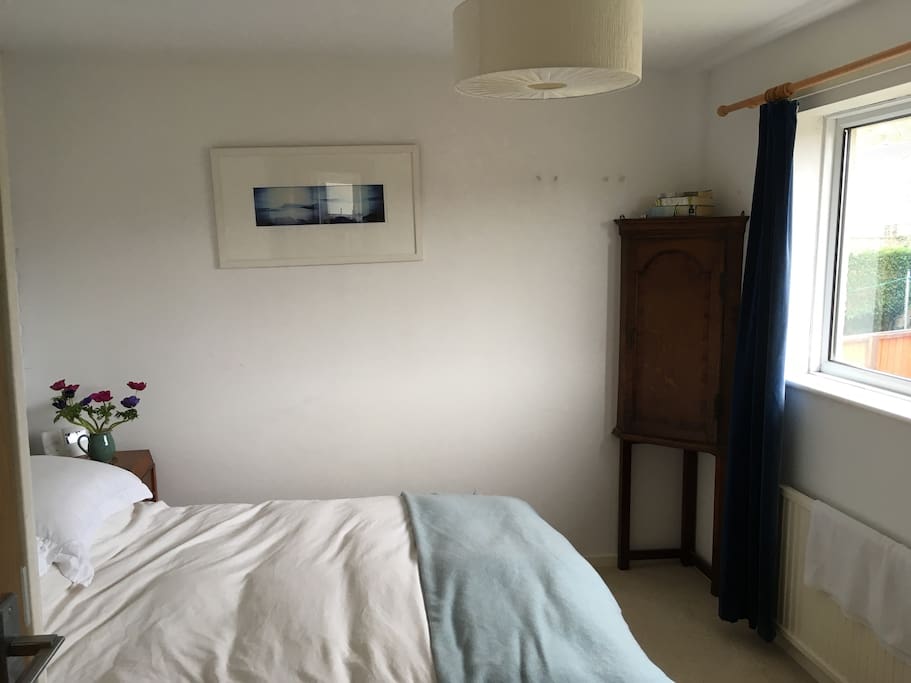 Light main bedroom with double bed