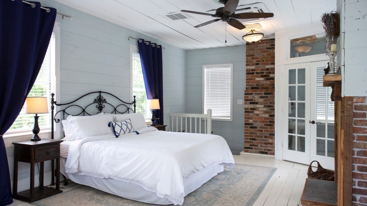 Shiplap before shiplap was cool! The house is loaded with 1800s detail like all wood walls, exposed brick, and hardwood floors.