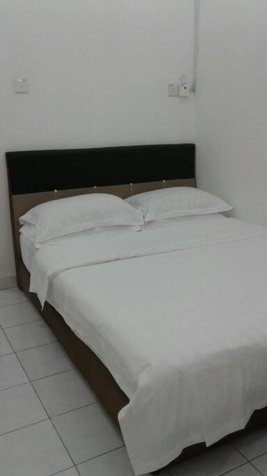 Master bedroom with a queen size bed .