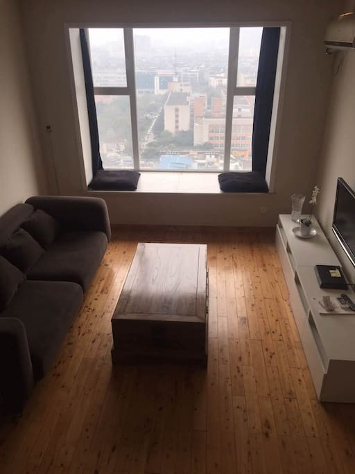 Comfortable living area with a beautiful view of the city.