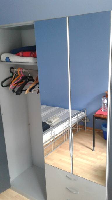 Wardrobe for your clothes and a big mirror.