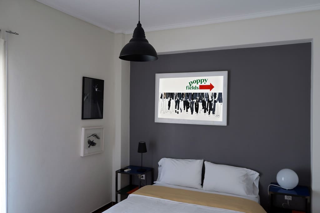Bedroom with Queen size bed and two night tables