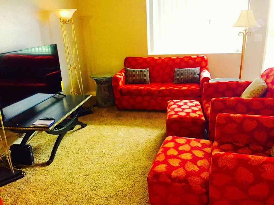 Living room with 55" LED tv And with full size sleeper sofa bed.