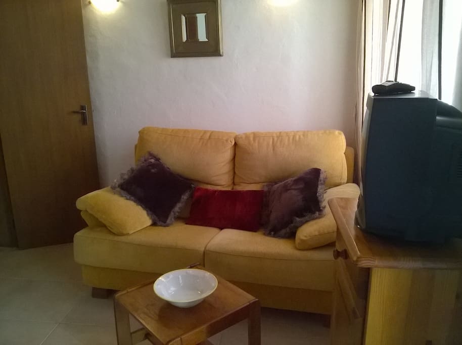 Living area with a two seat sofa...