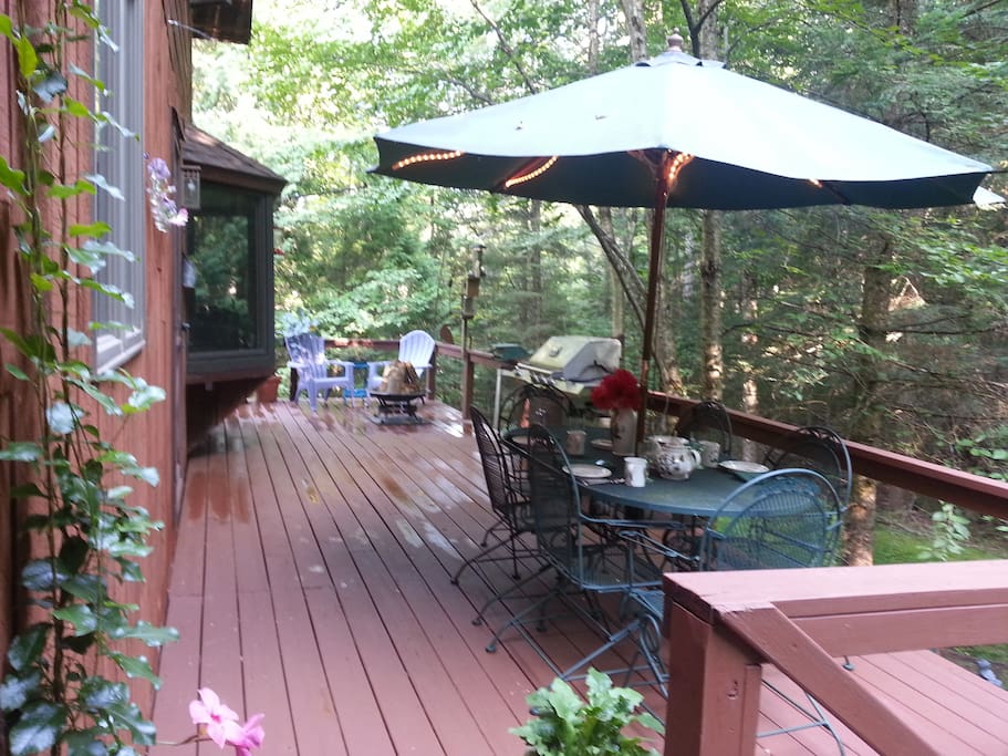 Fire pit on back deck and outdoor furniture for enjoyable dining
