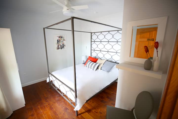 Woodpecker Bedroom - Queen Bed and double doors with Lake View and access to the main deck.