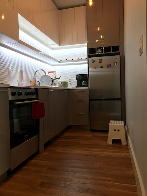 Clean kitchen with cooking utensils for food preparation