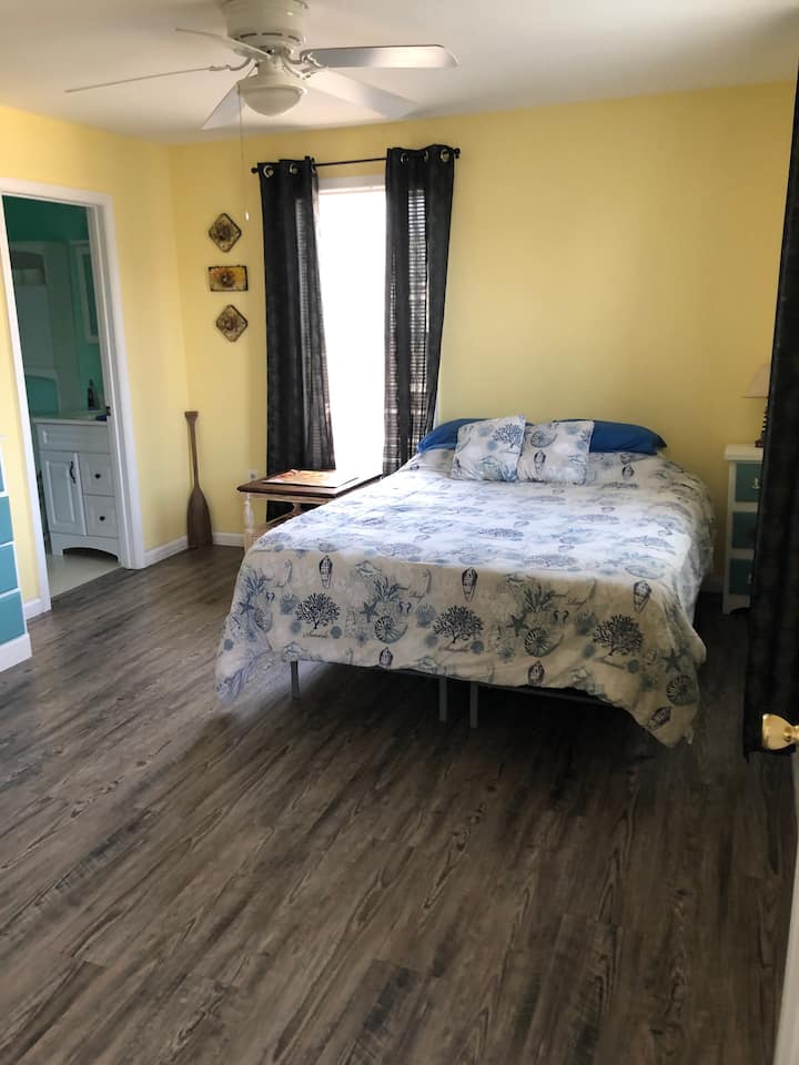 Master bedroom with Queen bed and full bathroom and walk-in closet.