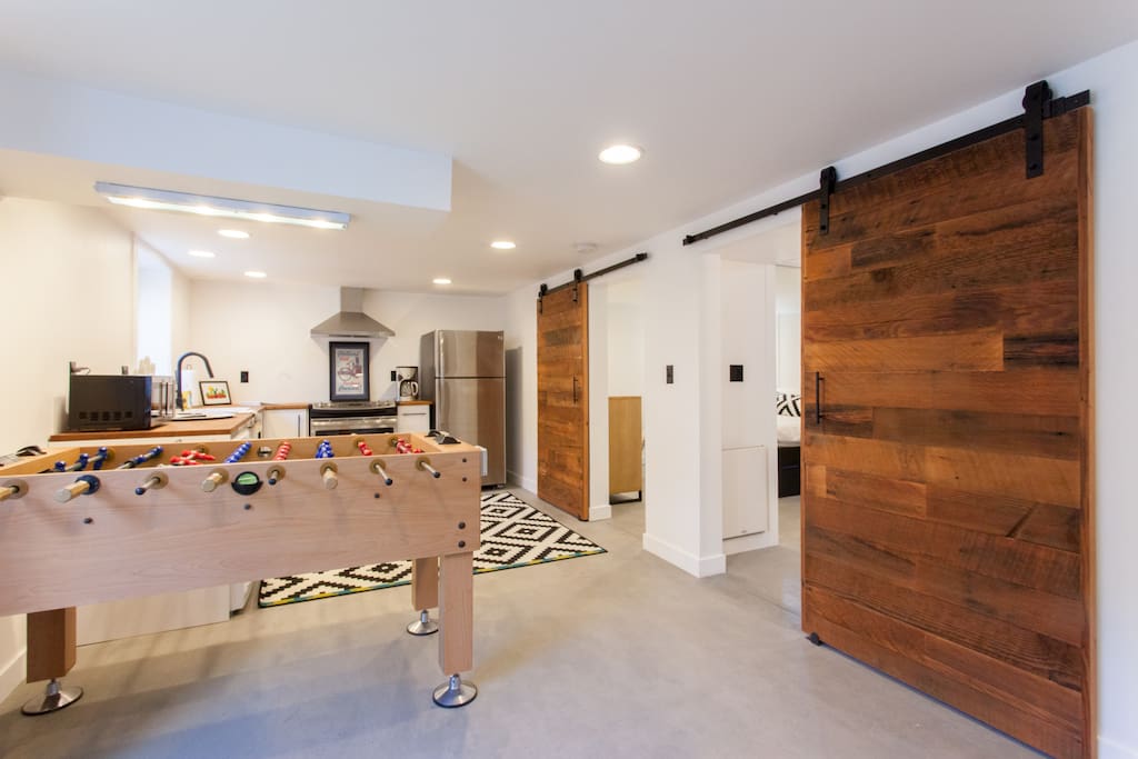 Open living room and kitchen, with beautiful reclaimed wood barn doors...