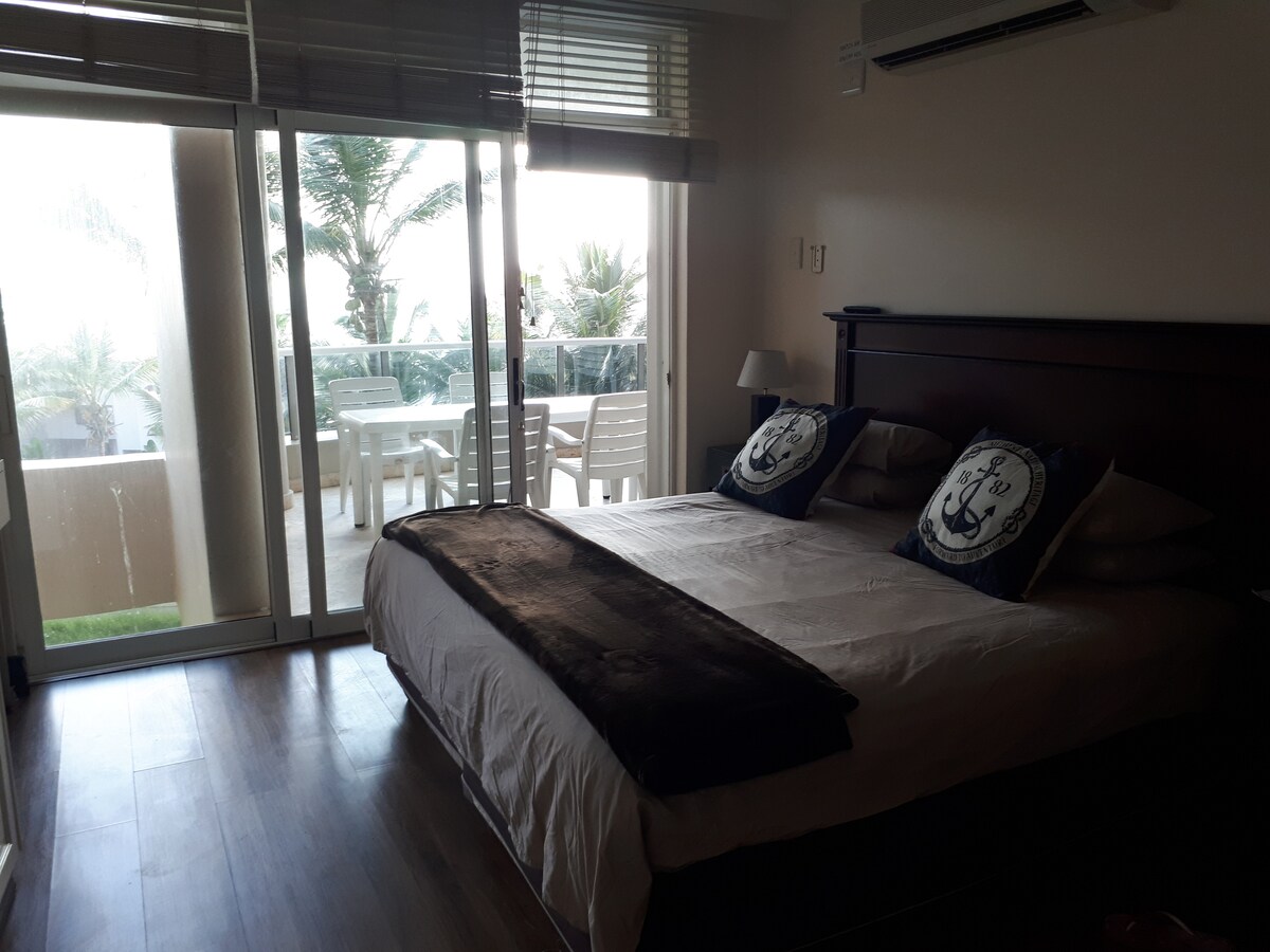 mano bedroom en suite leads onto balcony.