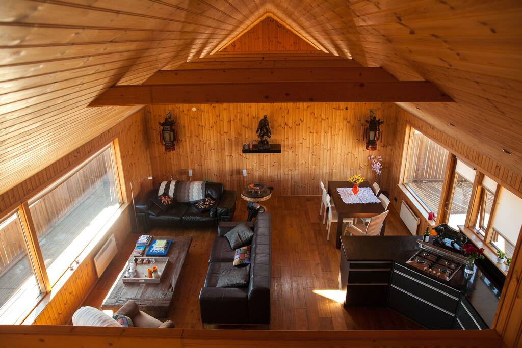 The living room seen from the sleeping loft