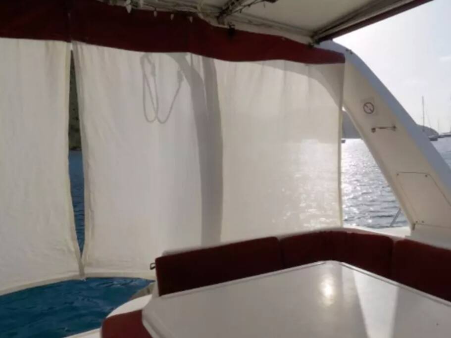 Cockpit seating, sun shades, and table