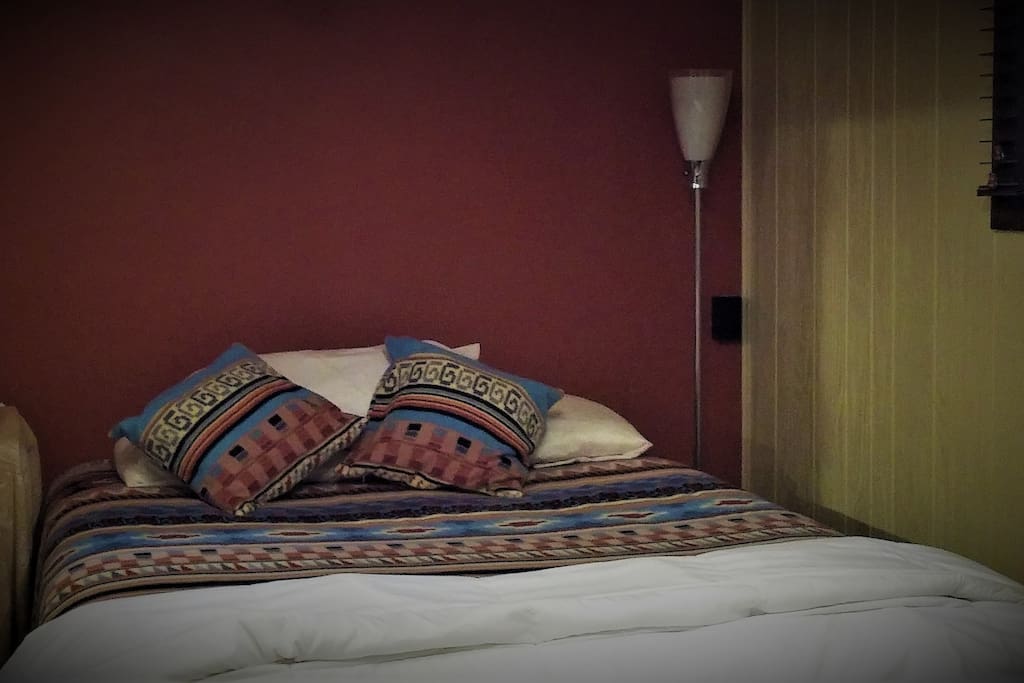 Your queen sized bed. Plug your laptop into the outlet built into the side table.