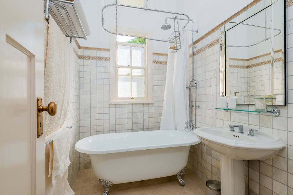 Brand new marble bathroom with deep claw foot tub