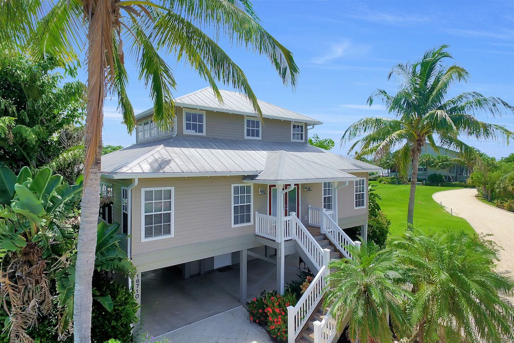 Old Florida style with lush tropical landscaping