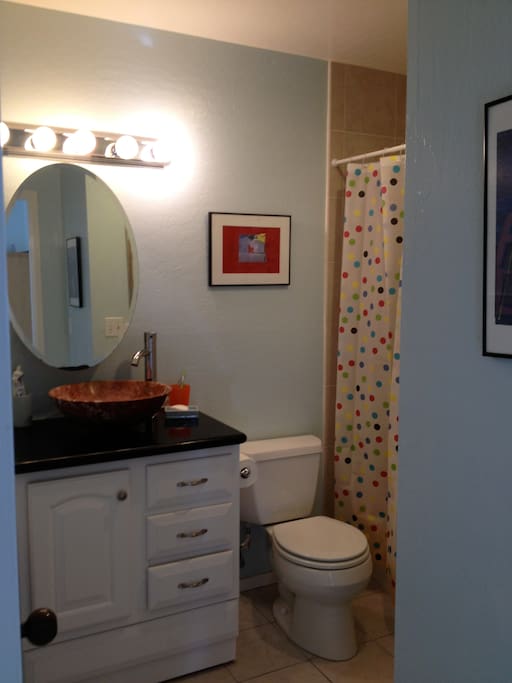 Soft blue shared bathroom.