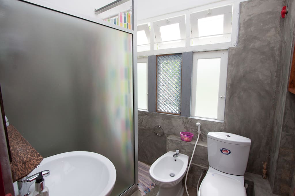 bathroom with shower cubical & bidet