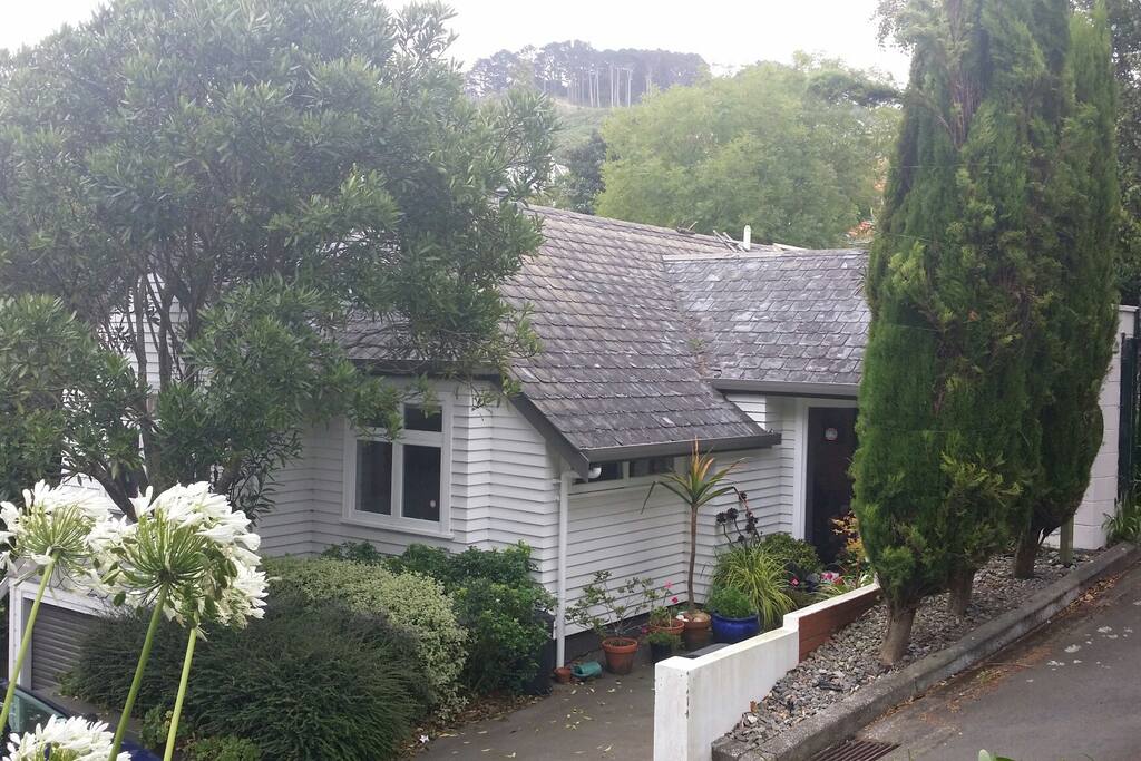 Street view of property with drive on car pad or street parking