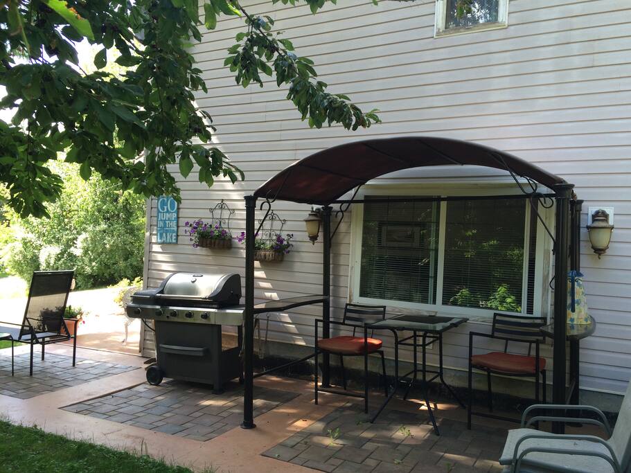 Private Patio area with bbq, fire pit, eating area and chaise lounges to enjoy the view of the lake and mountains