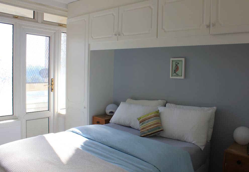 Double bedroom leading onto balcony