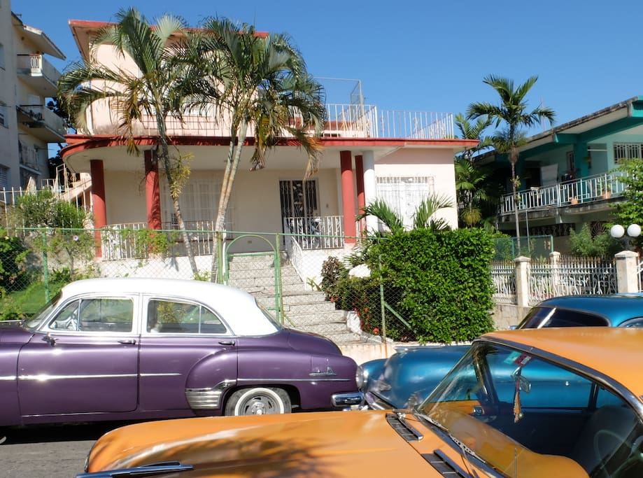 Front view of the house with some of the old cars cruising the streets of Havana