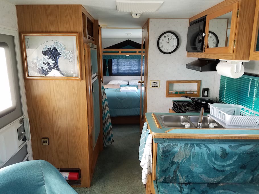 looking to the rear, stove and sink on right, fridge on left