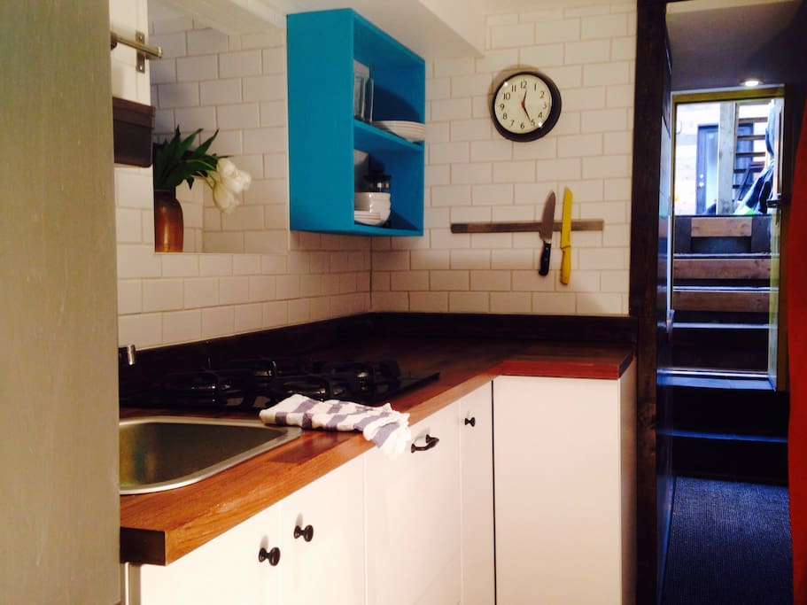 Newly installed kitchen with butcher block counters, gas range, fridge - all brand, spanking new.