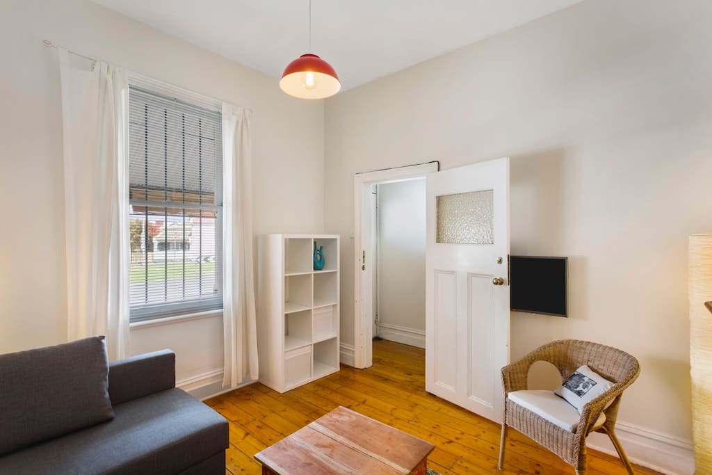 Wifi (unlimited), wall-mounted TV, small stereo with phone jack, panel heater, leafy quiet street