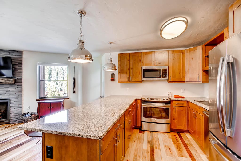 Kitchen is equipped with stainless appliances and tons of granite counter space! We have it stocked with everything you will need to prepare a family-style meal! Pots, Pans, Dishes, all the way down to the measuring spoons.