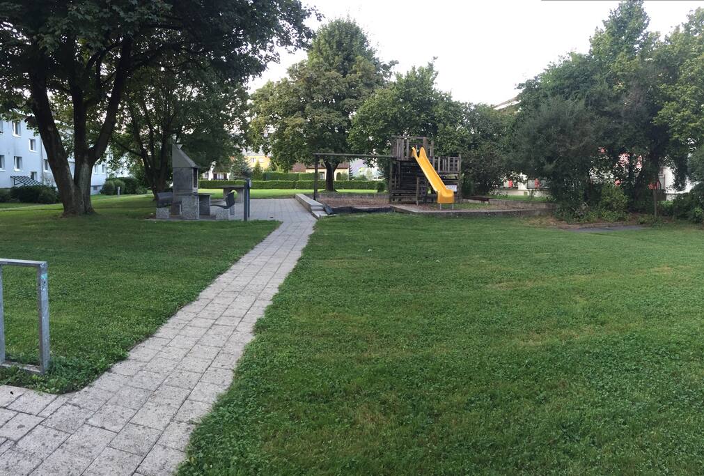 The park outside the door, with playground and BBQ possiblity