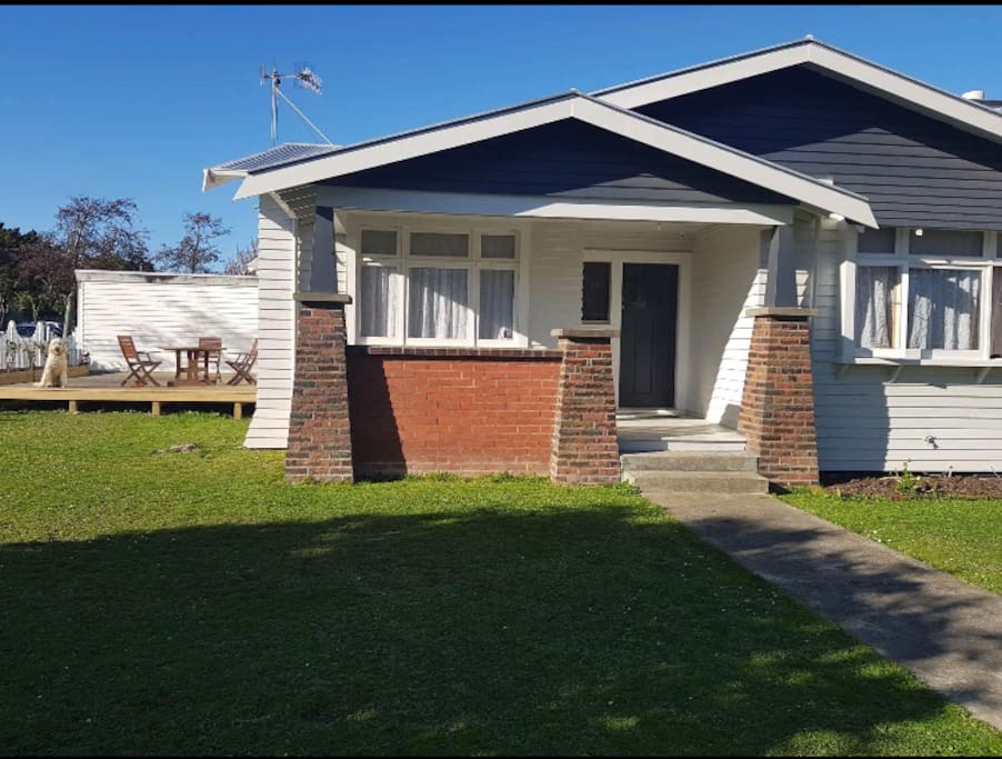 Front of the house, deck and Murphy.