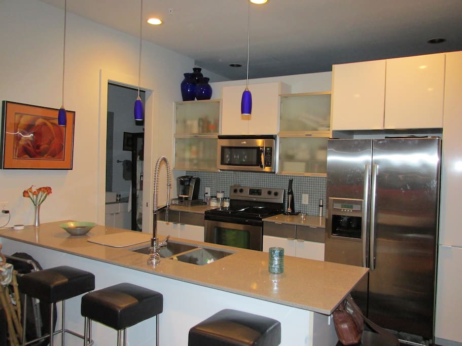 Open kitchen; connects to bathroom.