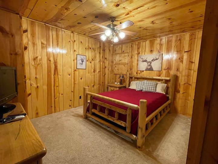 Moose bedroom located in the basement beside bathroom. Queen size bed. 