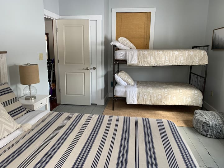 Lake House - Bedroom located on main level with queen bed and twin bunk beds