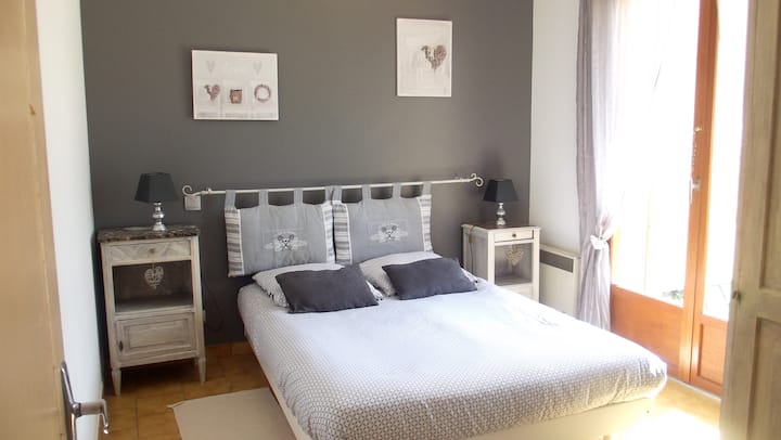 grey room with window door access terrace behind house