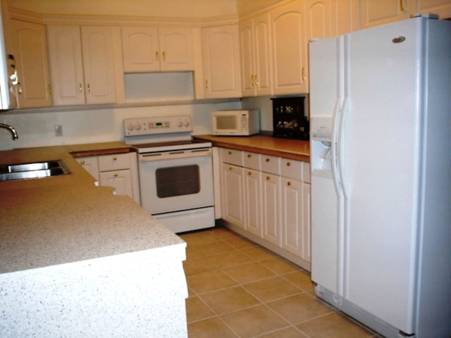 Kitchen with granite counter tops, and all necessities