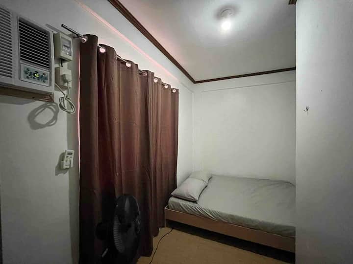 Queen size bed with aircon and wardrobe