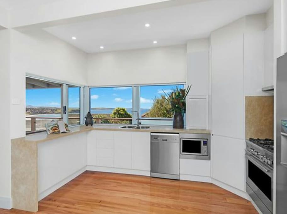 New well equipped kitchen, overlooking the ocean.