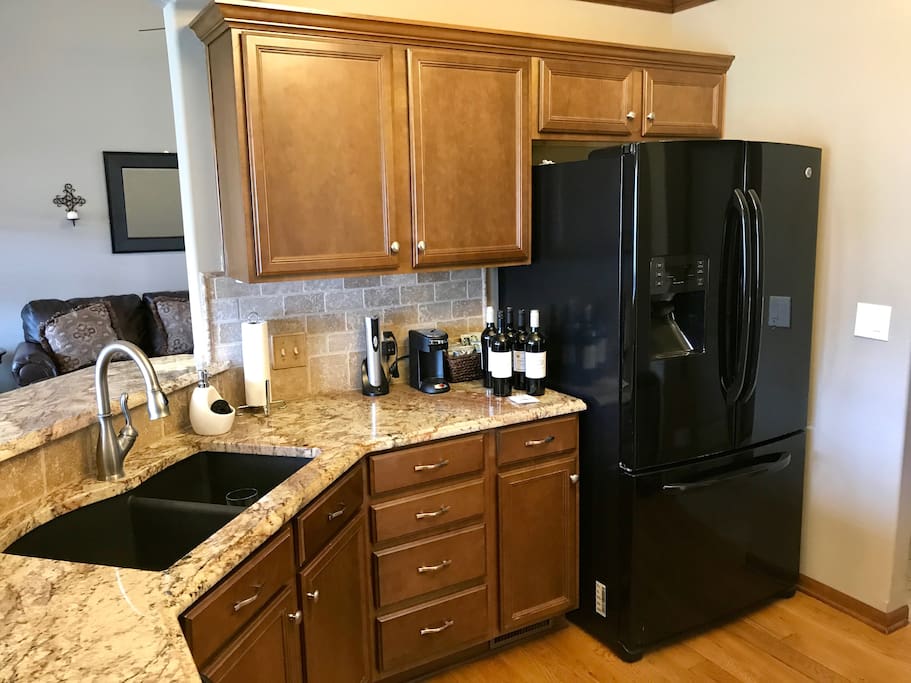 Beautiful granite counter tops and double door refridgerator