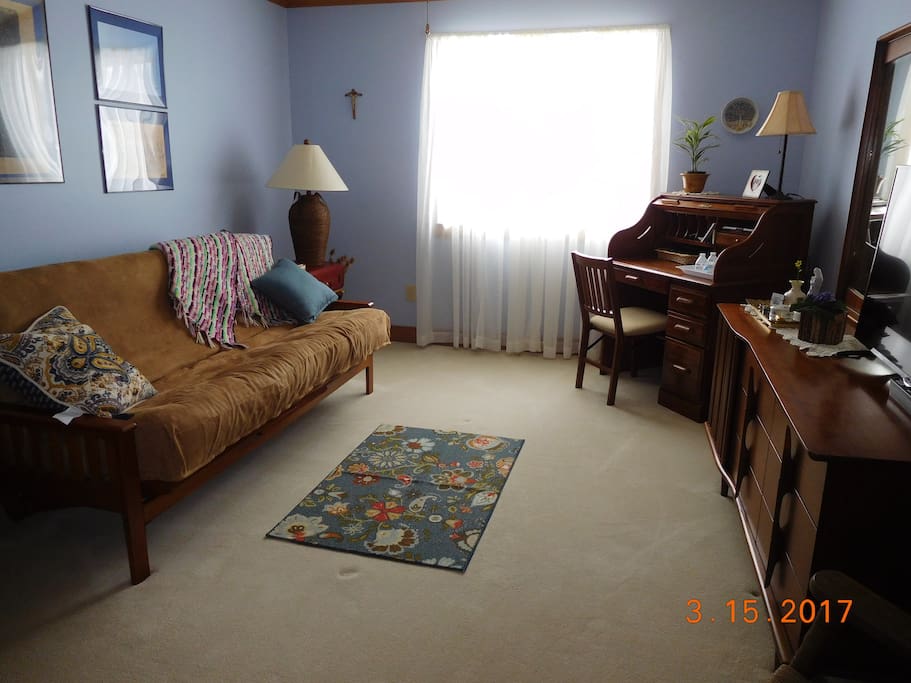 Room 2 with regular futon, desk and TV