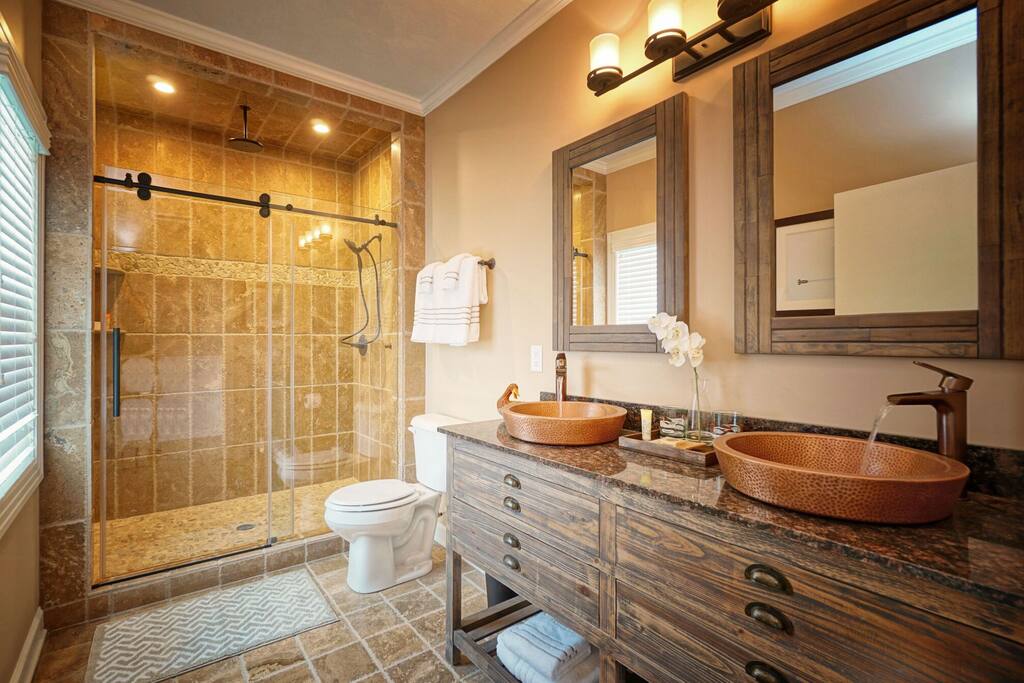 Dual sinks and stone showers and dual shower heads