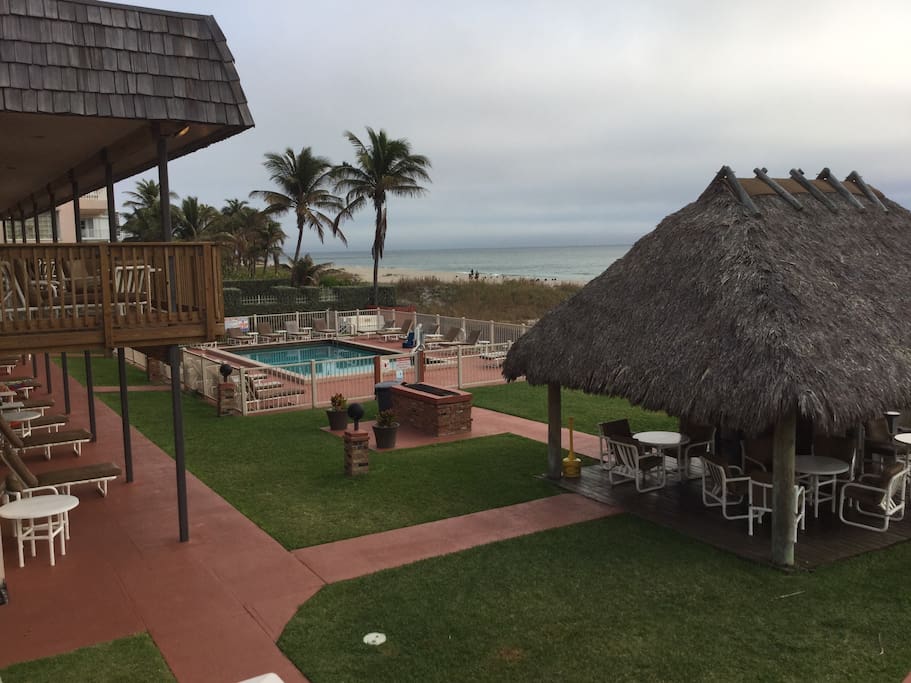 The heated pool just beyond the tiki hut.