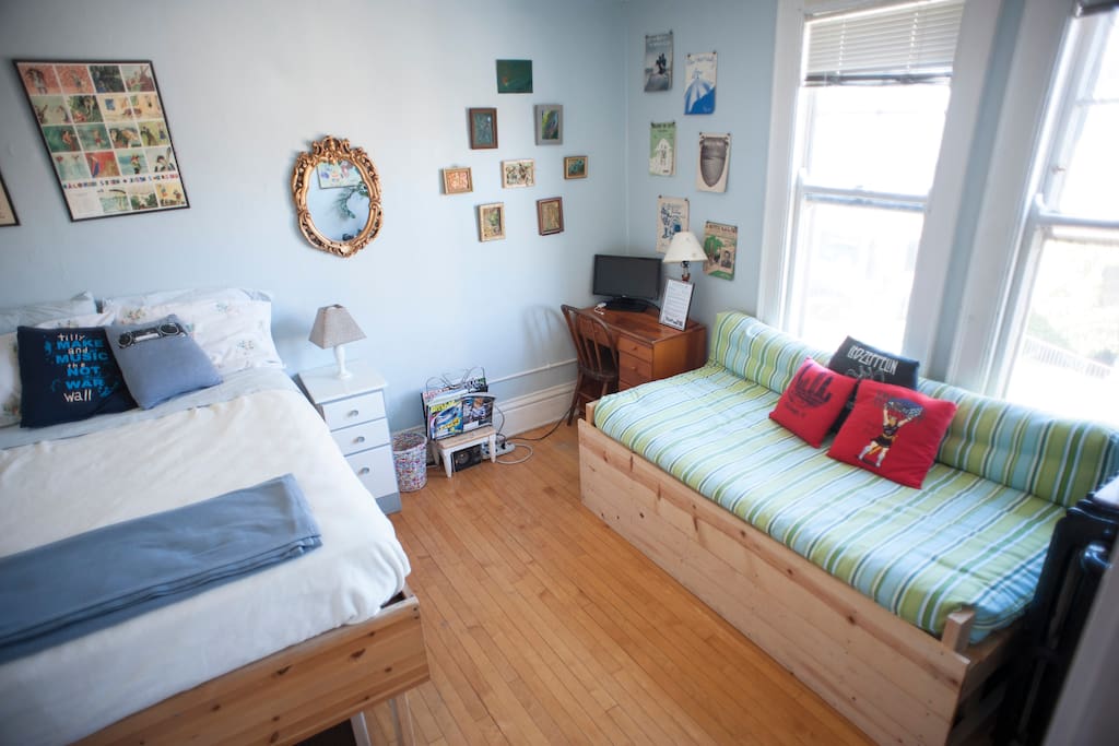 The guest room, which features a lofted queen bed and a couch; for larger parties, the couch folds down to a second queen bed.