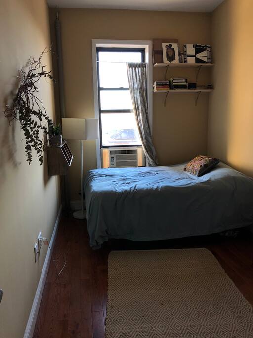 Full-sized bed with a great view! Wall cubbies for storage.