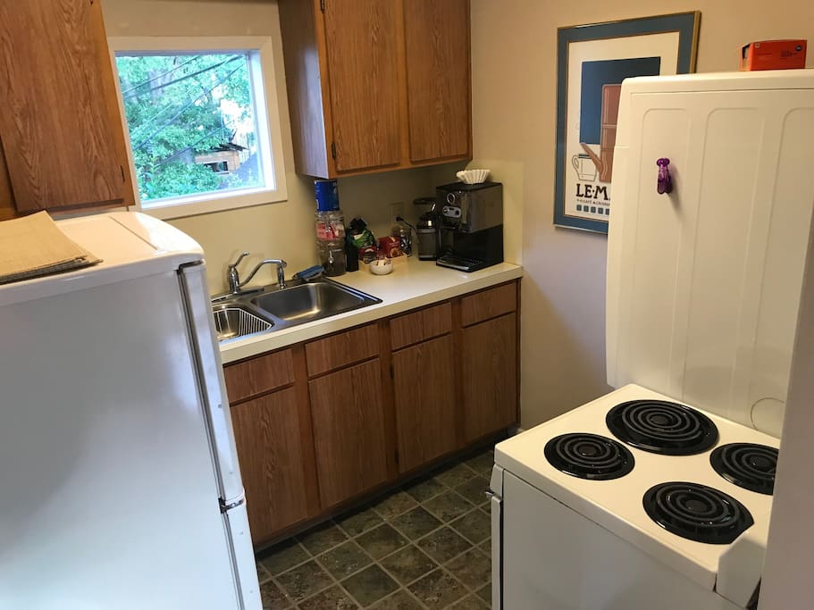 Full kitchen with coffee maker, microwave, stove and oven, frig and freezer, and washer dryer!