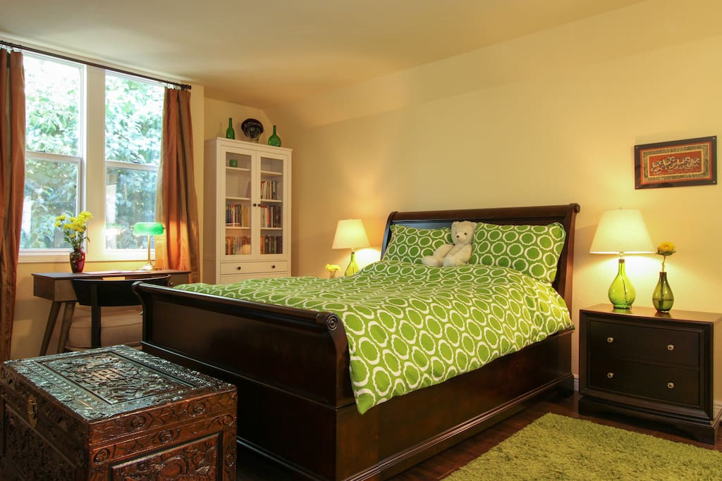 Roomy queen sized bed with two nightstands, extra blankies at the foot of the bed. High quality foam mattress.