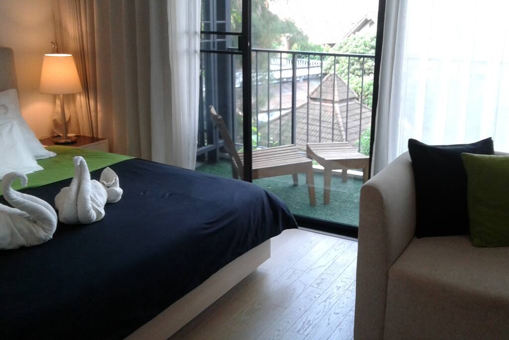 Bedroom/Living Room next to balcony with slidable door to separate from each other when needed